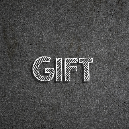"Gift" written on a chalkboardの写真素材