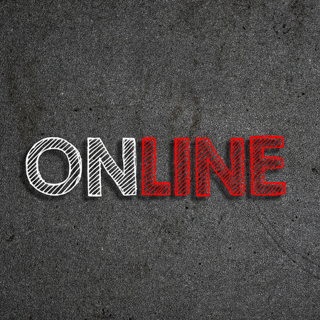 "Online" written on a chalkboardの写真素材