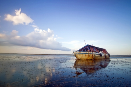 The low tide boat abandonedの写真素材