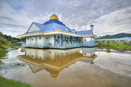 blue mosque and the reflection in the lake during cloudy day. noise visible due to high iso and long exposureの写真素材