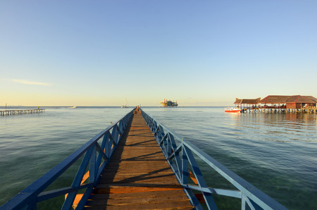 Long pier dan beautiful coral at Mabul Island.の写真素材