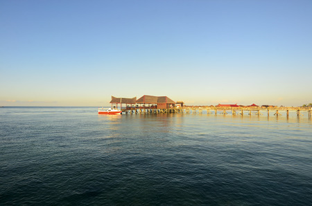 Long pier dan beautiful coral at Mabul Island.の写真素材