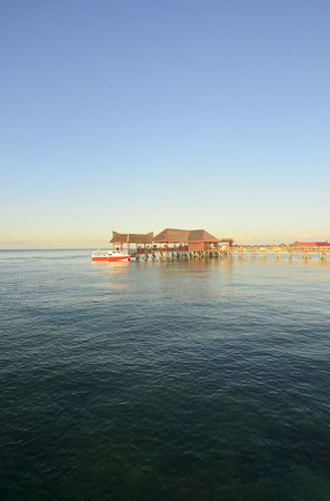 Long pier dan beautiful coral at Mabul Island.の写真素材
