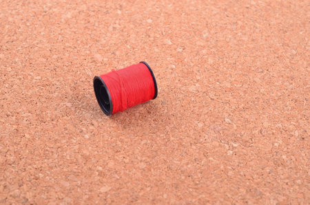 still life of spools of thread on a wooden background.
