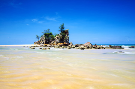 Unique rock formation on seaside with beautiful blue sky.の写真素材