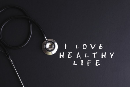 I LOVE HEALTHY LIFE word with stethoscope - health concept. Medical conceptualの写真素材