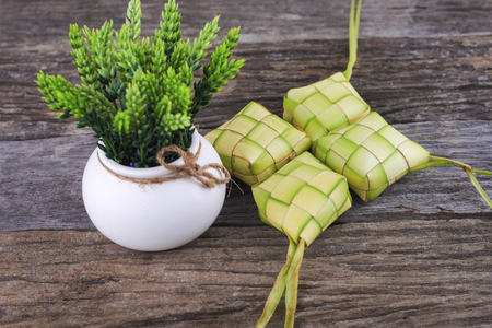 Ketupat on wooden backgroundの写真素材