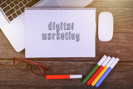 Digital Marketing text on wooden desk with tablet pc and keyboard
の写真素材