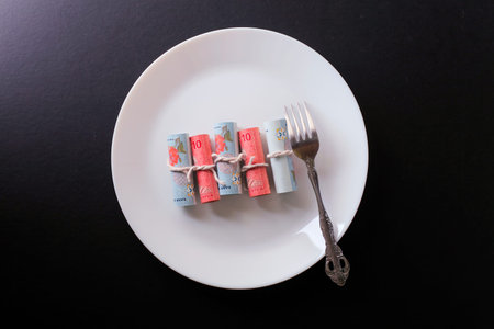 Conceptual composition, white plate full of malaysia moneyの写真素材