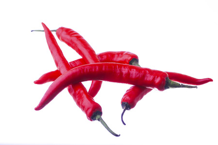 Red chili or chilli cayenne pepper isolated on white backgroundの写真素材