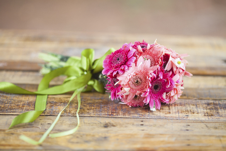 Beautiful hand bouquet for bride on wooden backgroundの写真素材