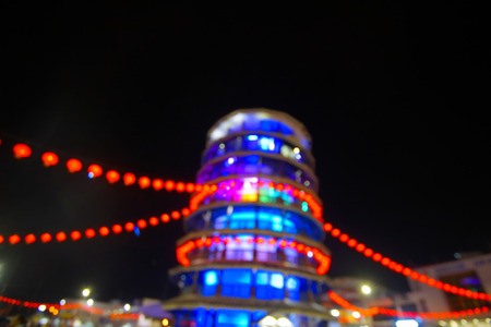 Blur Image of The leaning tower of Teluk Intan or 'menara condong' decorated with red lanterns during the celebration of Chinese New Year.の写真素材