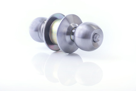 Close up of Stainless steel round ball door knob components isolated white background as Locksmith concept.の写真素材