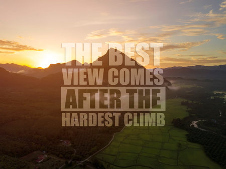 Inspirational motivation quote The best view comes after the hardest climb on nature background.