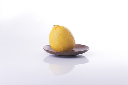 Fresh lemon fruit isolated on white backgroundの写真素材
