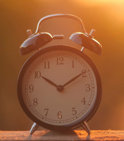 Black alarm clock on the morning