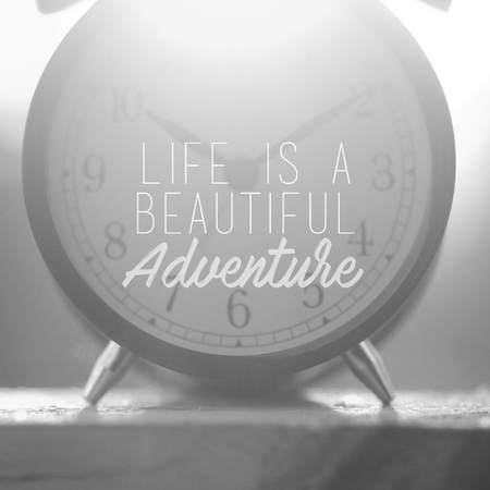 Travel inspirational quotes - Life is a beautiful adventure. Blurry retro styled background.の写真素材