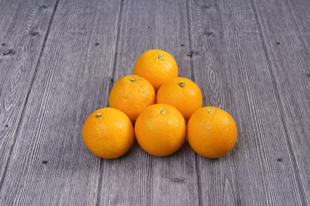 Basket of oranges on wooden backgroundの写真素材