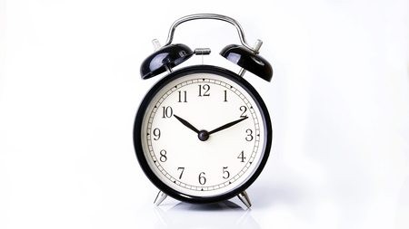 Black Alarm clock isolated on white backgroundの写真素材