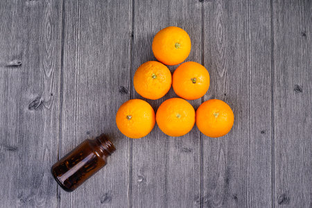 Top view of fresh orange go out from bottleの写真素材