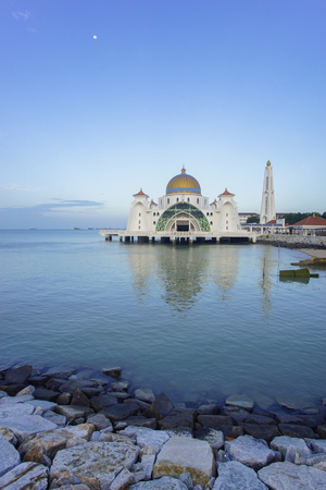 Majestic view of Malacca Straits Mosque during blue hourの写真素材