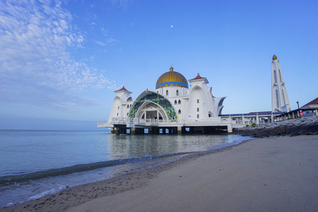 Majestic view of Malacca Straits Mosque during blue hourの写真素材