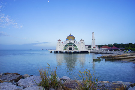 Majestic view of Malacca Straits Mosque during blue hourの写真素材