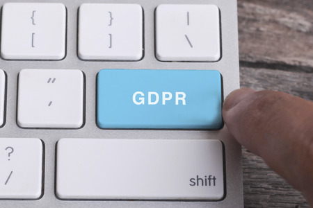 Close up of finger on keyboard button with GDPR  wordの写真素材