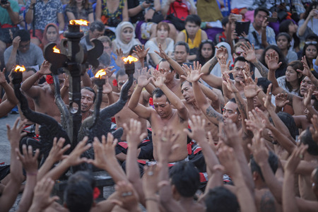 Bali, Indonesia - April 19: Tourists watch traditional Balinese Kecak Dance at Uluwatu Temple on Bali, Indonesia. Kecak (also known as Ramayana Monkey Chant) is very popular cultural show on Bali.のeditorial素材