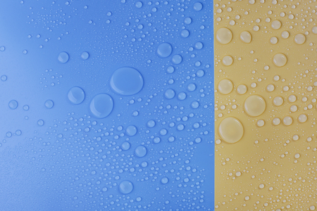 Water Drops on blue and yellow backgroundの写真素材