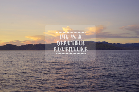 Travel inspirational quotes - Life is a beautiful adventure. Blurry retro styled background.の写真素材