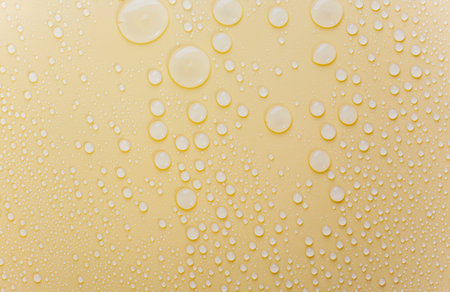 Close up of waterdrop on blue dan yellow background