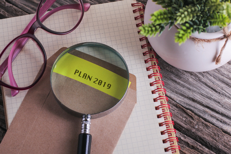 Business Concept : Plan 2019 written on envelope with woodenの写真素材