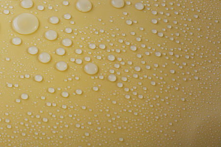 Waterdrop on blue and yellowの写真素材