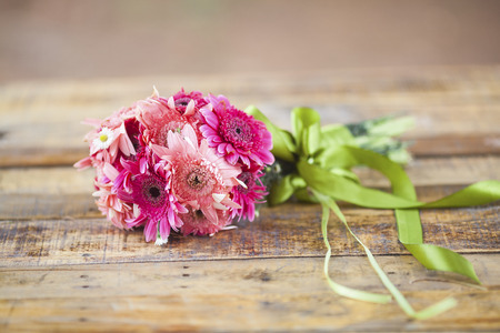 Beautiful hand bouquet for bride on wooden backgroundの写真素材