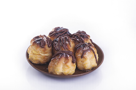 Chocolate cream puff isolated on white backgroundの写真素材