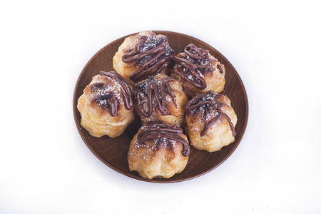 Chocolate cream puff isolated on white backgroundの写真素材