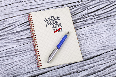 Action Plan word on a notepad woodenの写真素材