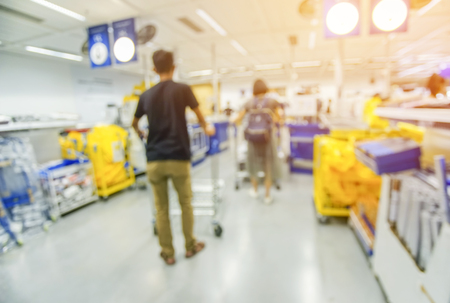 Blurred image of people paying at the cashier in a convenience store.の写真素材