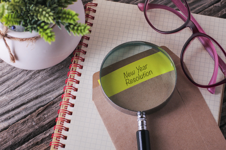 Business Concept : New Year Resolution written on envelope with woodenの写真素材