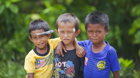 Semporna Sabah, Malaysia - July 18, 2017: Scene at Mabul Island. Sea Gypsy kids  in Bodgaya Mabul Sipadan Island, Sabah Borneo, Malaysiaのeditorial素材