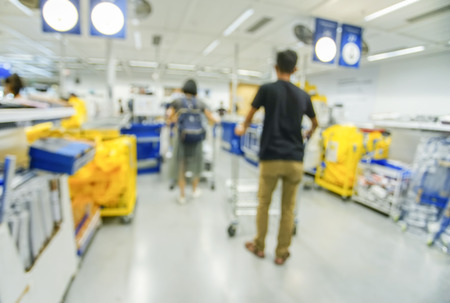 Blurred image of people paying at the cashier in a convenience store.の写真素材