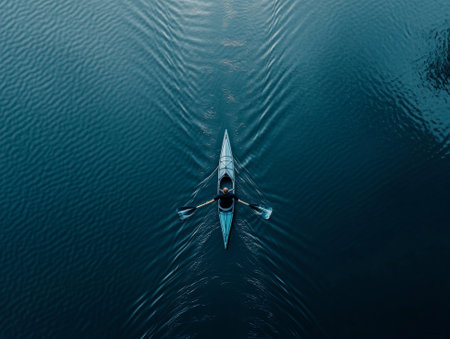 Man rowing his canoe on a lake, - aiの素材