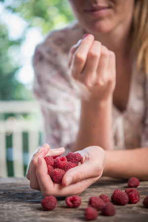 Picture of lovely woman with raspberriesの写真素材