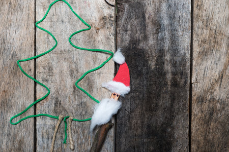 Christmas tree made of green wool and Santaの写真素材