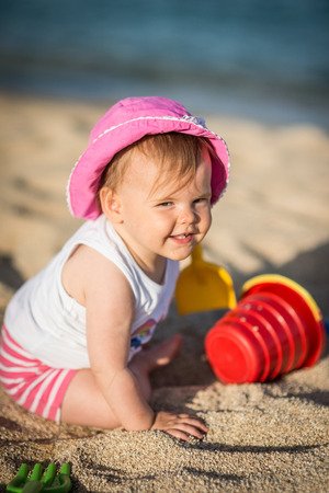 Caucasian little girl playing with bach toysの写真素材