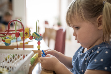 Curious caucasian girl is playingの写真素材