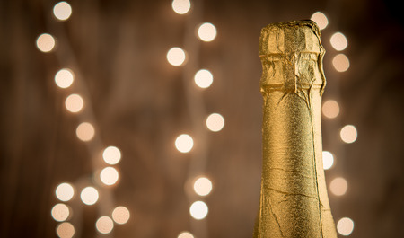 Champagne Glasses Infront Of Defocused Lights as Christmas or New Year party backgroundの写真素材