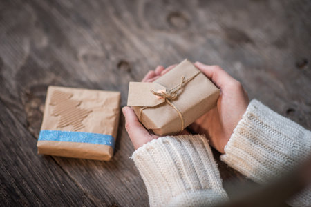 Female hands and Christmas or New Year presents