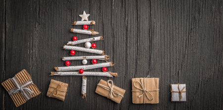 Holiday background with Christmas tree and gift boxesの写真素材